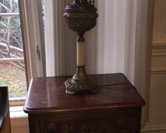 End table with globe lamp.