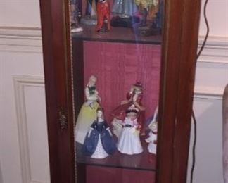 Curio cabinet with collectibles.