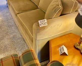Lot 4340. $795.00. Ethan Allen contemporary sofa in medium tan w/ cream color piping, 2 cushions on seat and back. Excellent Condition in a great neutral color that will go with anything (the lighting in this home makes photographing difficult, but it's really nice!) Measurements: 76"L x 36" D x 36" to top of the cushion, seat height is 19". 