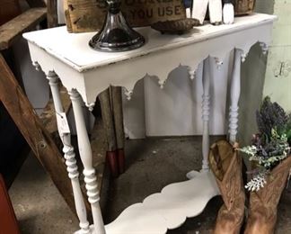 13” x 22.5” white table. $38. Cowboy boots.   Lots of   old boxes. 