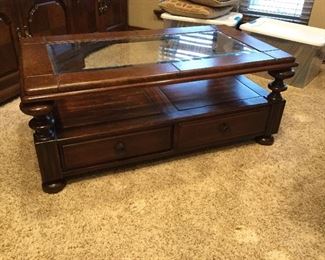 Handsome coffee table with handy drawers in good condition 