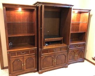 Entertainment Center that is 9’ wide but is made in 3’ sections, lighted display with lots of storage 