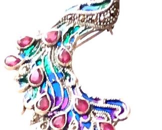 Plique a hour jeweler sterling large peacock brooch. This brooch has translucent see through enamel ( light if day in French ) and is hand set with rubies and marcasites in heavy sterling silver! Breathtaking and RARE!