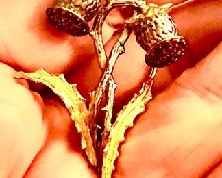 Hand made hand cast thistle pendant with tiny rubies and gold overlay. Not real big but exquisite!