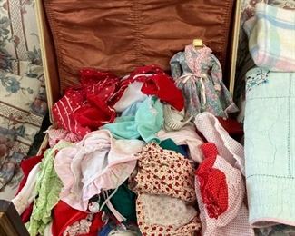 Vintage Doll clothes in a vintage suitcase
