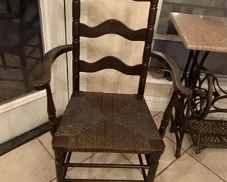 $125 CANE BOTTOMED DARK WOOD CAPTAIN'S CHAIR