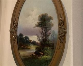$225 UNSIGNED OVAL FRAMED LANDSCAPE WITH LAKE