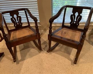2 CANE BOTTOMED ROCKING CHAIRS WITH ARMS AT $200 EACH  SOME STRETCHING DAMAGE ON THE RIGHT CHAIR BOTTOM.