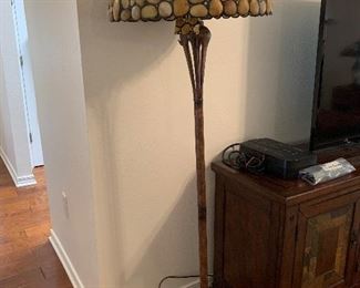 Tall lamp- very unique- shade looks like stones. Perfect for a cabin or primitive style home. $150  PRESALE   Text 850-781-6887