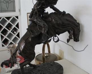 6. $400.00. Bronco Buster. Frederick Remington cast Bronze 20” X 19” X 17”