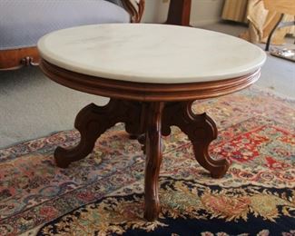 17. $150.00. Renaissance Revival style occasional table with marble top. Note: this table has been cut down. Common thing to do in the early 1900's. 18.5” X 34” X 24.5”