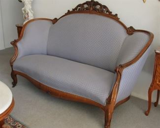 18. $400.00. Gondola style sofa. Carved crest rails. 45.5” X 65” X 28”