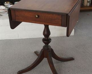 41. $200.00. Imperial Grand Rapids Drop leaf side/work table. Note: missing brass covers for the feet. 27” X 21” X 18” extended 35”