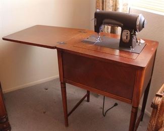 45. $150.00. Kenmore E 6354 sewing machine with cabinet