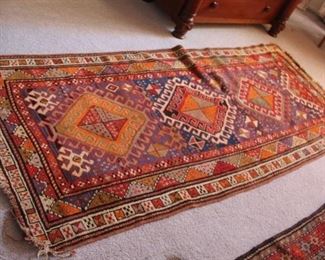 61. $150.00. Handmade rug 90” X 38.5”
Appears to be cut down from a larger piece.