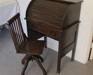 67. $175.00. Childs roll top desk with chair / Desk 36” X 26” X 16” chair 31” X 13” X 13”
Circa 1920.