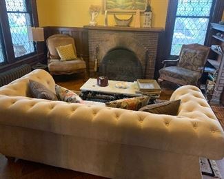 TUFTED CHESTERFIELD SOFA, MARBLE COFFEE TABLE, ORIENTAL RUG, ACCENT CHAIRS, DECOR, BOOKS, TABLE LAMPS