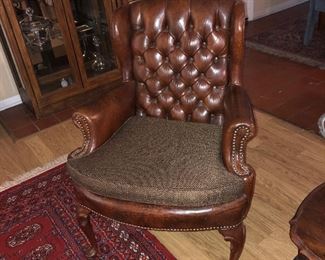 One of 2 tufted chairs