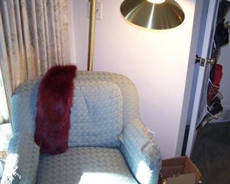ONE OF A PAIR OF EASY CHAIRS, BRASS LAMP & FUR SCARF