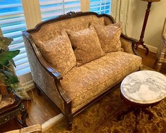 the first of two matching French settees in the house