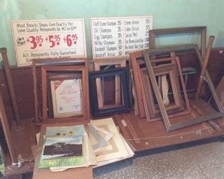 lots of old wood picture frames. 