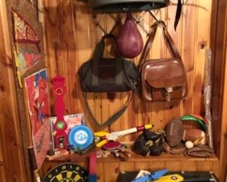 vintage sporting equipment, speed bag, bow and arrow, pennants, dart board, frisbees, more