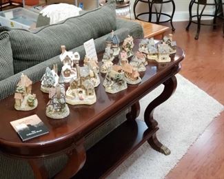 David Winter Cottages and Collectors Guide on a Sofa Table