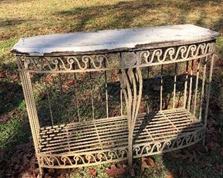NOW $120. Solid iron table base. Console table / media / sideboard. indoors or out. top needs replaced. piece of glass or stone remnant would look great. quality crafted piece! 