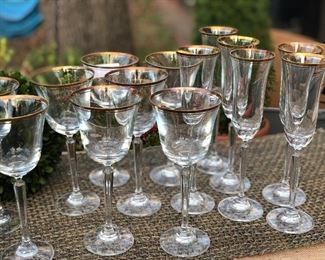 $50! SET of 15. 7 WINE glasses. 8 Champagne flutes. Gold rims. crystal bases. beautiful! 