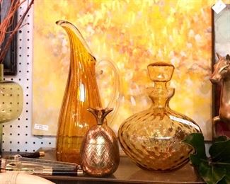 1. $75 XL ORBIX glass blown pitcher. 
2. $10. BLENKO glass amber decanter 
3. $15. Brass pineapple 
4. $60. Abstract art piece 