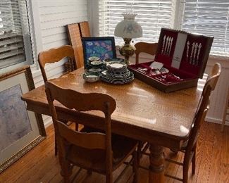 $195.00 set.     42” Square oak Farmhouse table with 4 leaves & 4 chairs 
