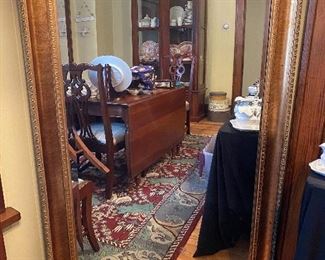 $85.00  Beveled mirror w/wood framed 5' by 3’2”.  Wood frame has burnished gilt finish