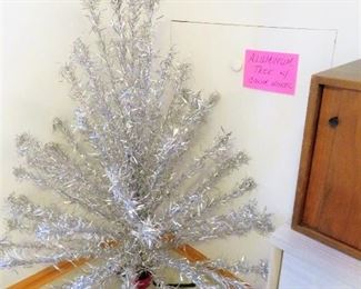 A RARE BEAUTY 4 1/2 FOOT ALUMINUM CHRISTMAS TREE, HAS ALL PARTS, AND A COLOR WHEEL AS WELL.