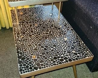 Set of 4 Mosaic tables. Black and gold pebble tiles. Brass trim. All four pieces are in excellent condition. $950 for all (compared to $1,300 and over)
Coffee table: Kidney shaped 49" w x 13.5"h
2-tier tables (quantity 2): 18"w x 23"h x 29.75"d
Square table: 14.5" x 14.5" x 21"h
