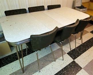 Vintage laminate chrome mid century table with 6 chairs. $90