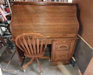 Solid wood roll-top computer desk with chair on casters. 48w x 29d x 51h. Purchased at Darvin Furiture. Only $150!