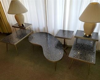 Set of 4 Mosaic tables. Black and gold pebble tiles. Brass trim. All four pieces are in excellent condition. $950 for all (compared to $1,300 and over)
Coffee table: Kidney shaped 49" w x 13.5"h
2-tier tables (quantity 2): 18"w x 23"h x 29.75"d
Square table: 14.5" x 14.5" x 21"h
