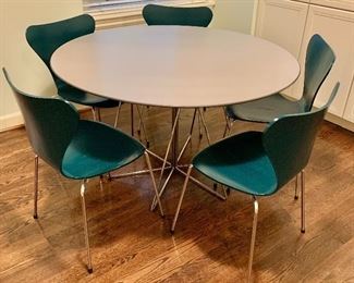 $495 - KnollStudio  "PaperClip" Table: 28.5" H x 48" diameter. $875 - Five Fritz Hansen butterfly chairs available: 31.25" H x 18" W x 18" D, seat height is 18" 