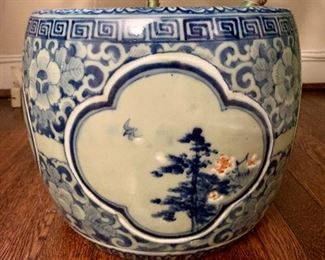 $225; Large porcelain planter; round vessel decorated with blue underglaze;  approx 14" high x 14" diameter; plant included