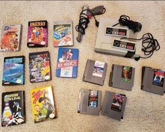 1985 Ninendo game console; gun; controller; games