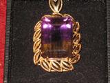 14kt pedant with approximately a 10 carat ametrine