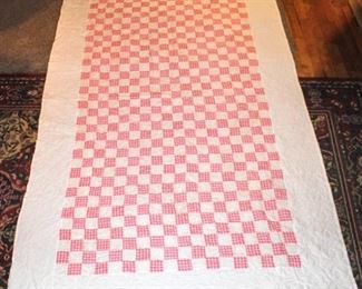 Pink and white Checkered Quilt measures 52" x 83" White Border with Pink and White Checkerboard Patchwork
