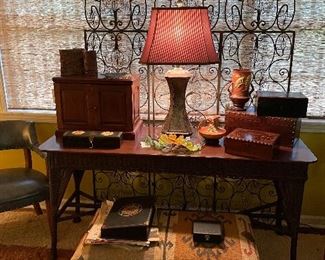 Antique English boxes abs humidors 
Kilim ottomans and antique books
Vintage wicker console 