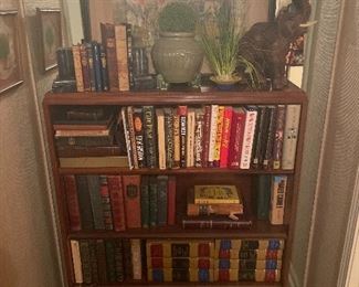 Pair of antique bookshelves and books