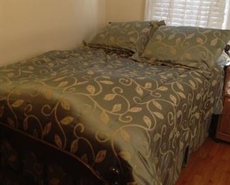 Full Size Bed with mattresses and bedding