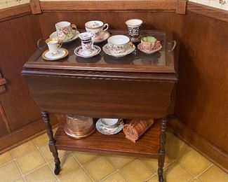 Yea cart with various cup/saucer sets