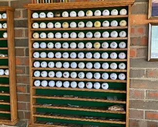 Collection of golf balls in shelf - 1 of 2