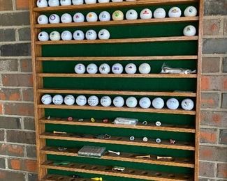Collection of golf balls in shelf - 2 of 2