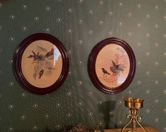 Two framed round pictures