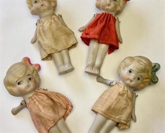 #61) $25 Now 50% off (was $50 ) for all 4 Vintage Bisque Dolls. Made in Japan, these Hand Painted Dolls have their original Dresses. Dolls measure approx 4 inches tall. We have not cleaned these.  Normal wear as shown. Arms are movable. (1 of 3 views) 